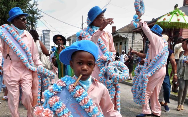 Charles M. Lovell, _Young Men Olympian Junior Benevolent Association Second Line, Central City, New Orleans_, 2012. Archival pigment print (detail). Courtesy the artist.