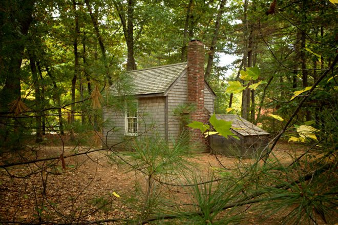 A recreation of Henry David Thoreau’s cabin on Walden Pond. Image via [A Journey through Literary America](https://literaryamerica.net/authors/henry-david-thoreau/).